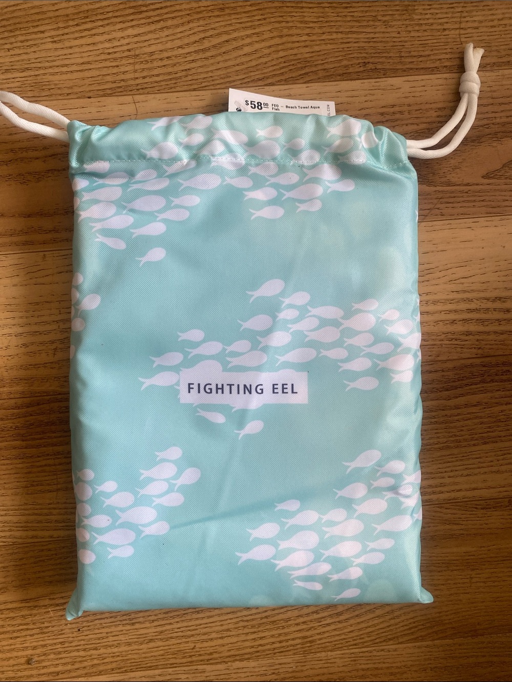 NWT. Fighting Eel Beach Towel Aqua in  Mint Drawstring Bag with White Fish Print